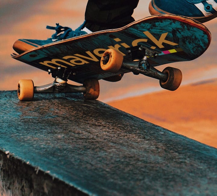 Skateboard performing a trick on ledge