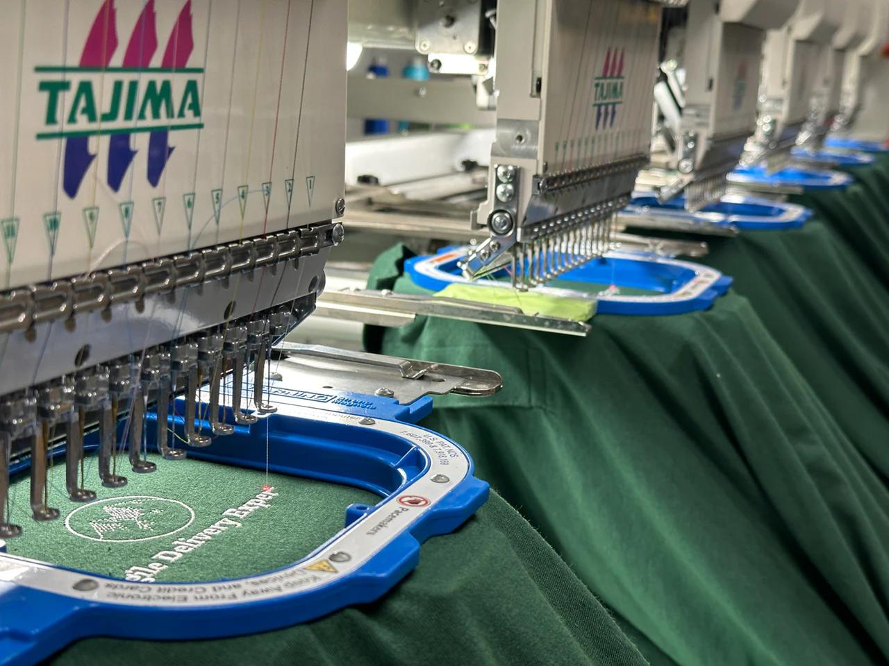Bulk production of embroidered shirts at Maverick Printing in Reno.