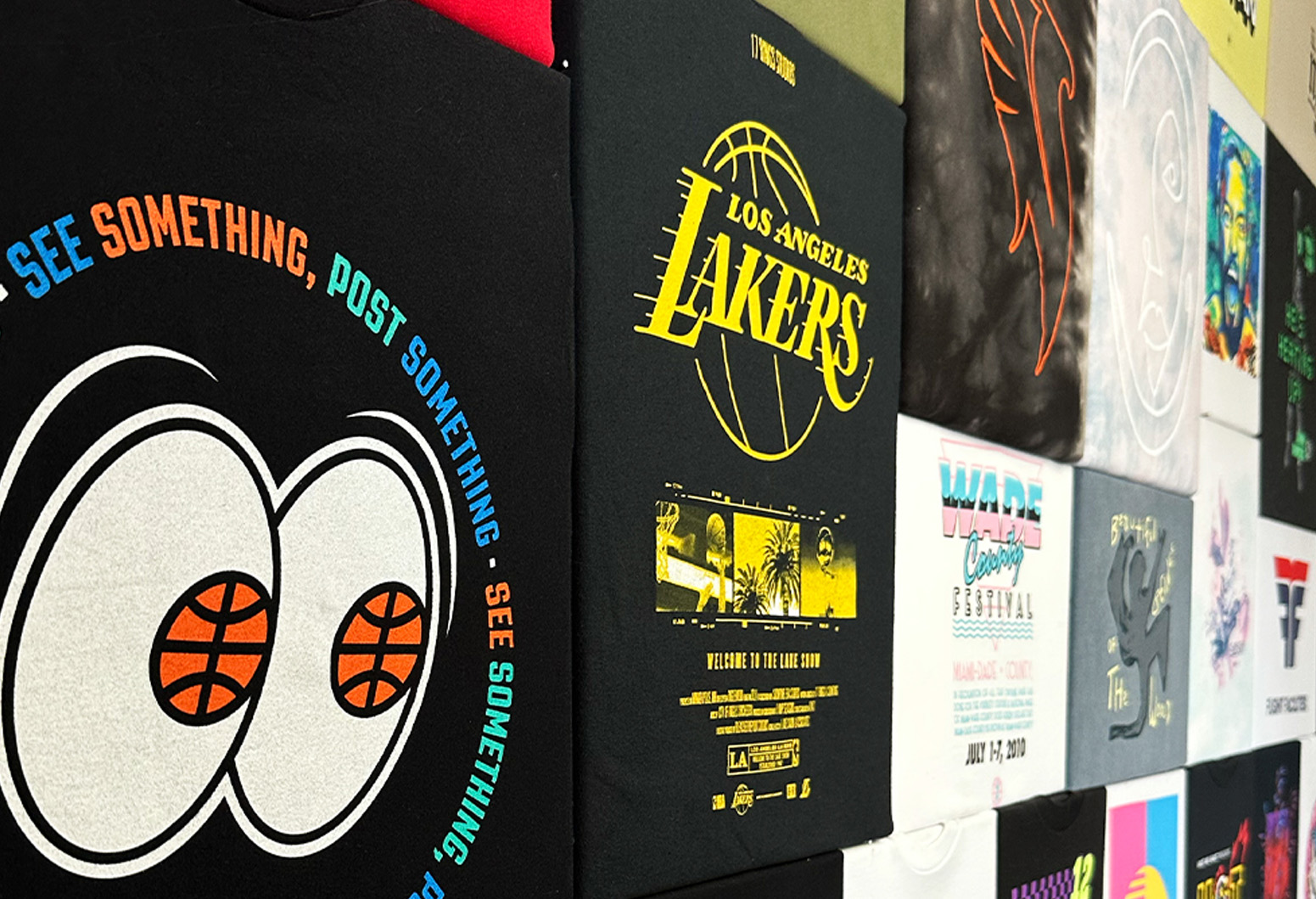TRIC-custom-t-shirt-screen-printing-dtf-maverick-reno Display featuring custom printed t-shirts.