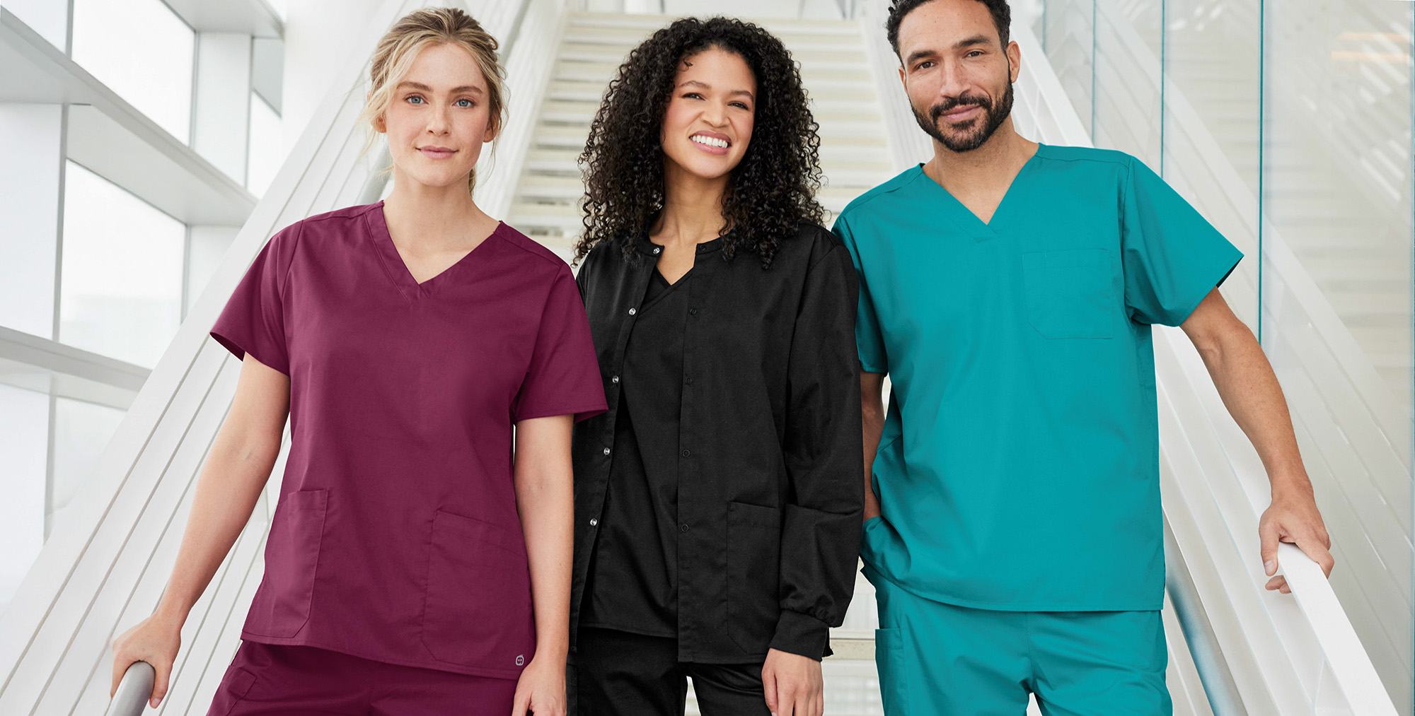 Three individuals in medical scrubs available through Maverick Printing in Reno.