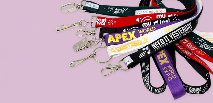 group of colorful, custom printed lanyards with various attachments illustrating the capabilities of maverick printing.